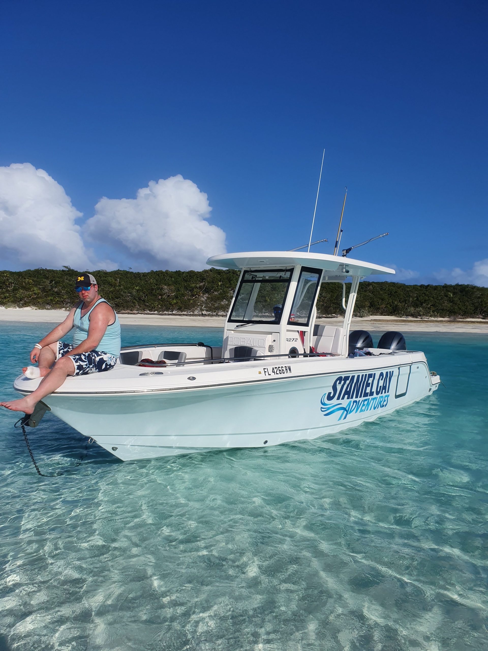A man sitting on a boat during the Staniel Cay Adventures tour.